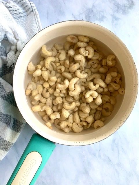 process photo of boiled cashews in a pot