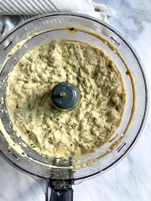 process photo of vegan spinach and artichoke dip in a food processor 