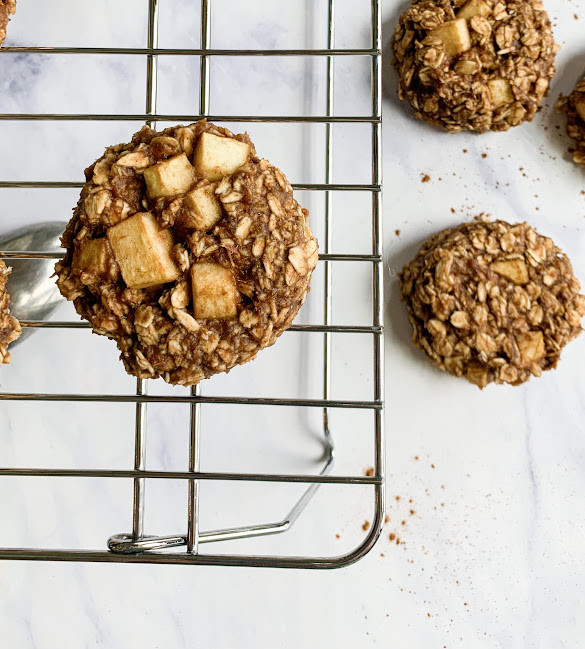 Square image of the vegan breakfast cookie on a wire rack and white countertop.