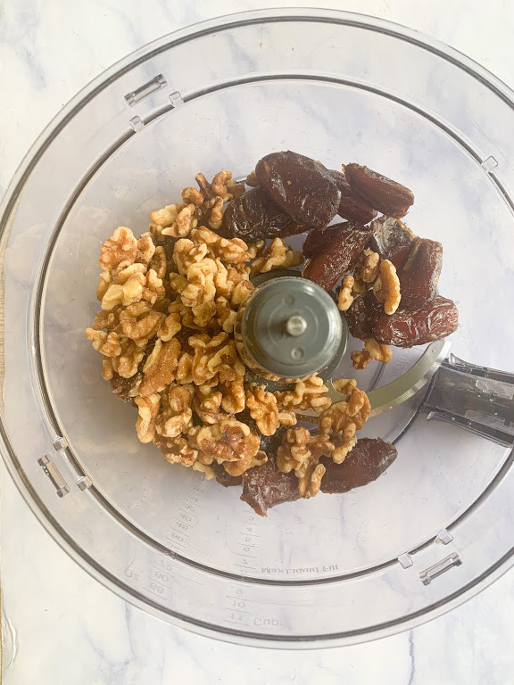 walnuts and dates in a food processor 