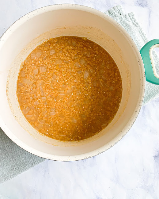 cooked red lentils in a large pot 