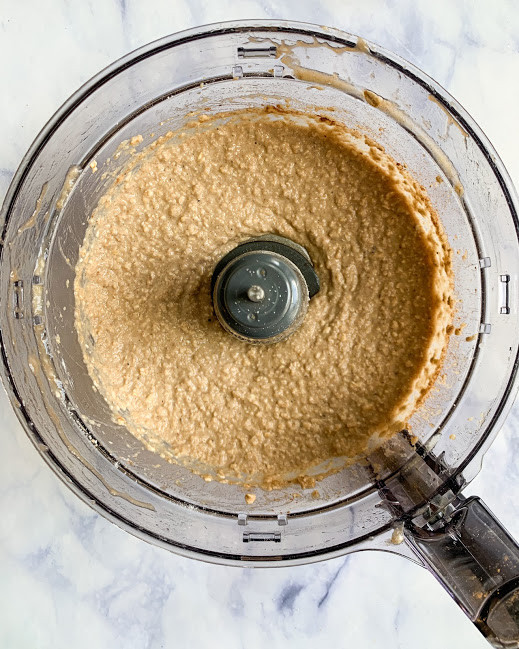 vegan chai banana bread donut batter in a food processor on a white background 