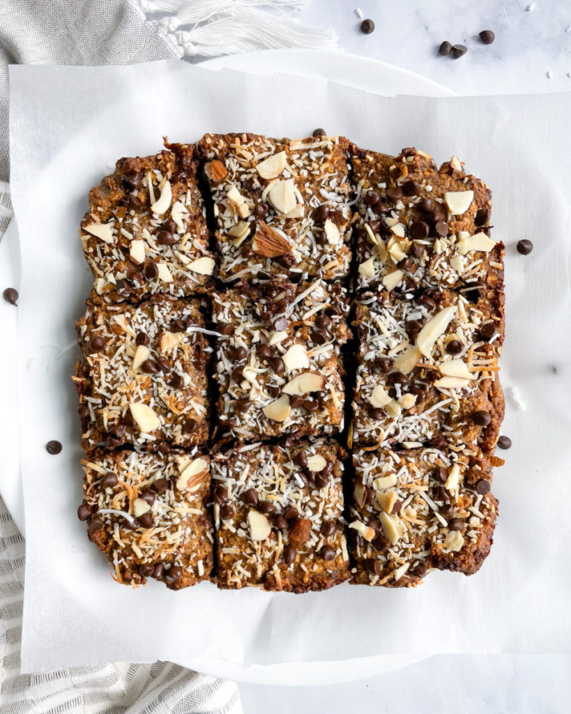 healthy vegan oatmeal bars on a white plate on a white counter top 