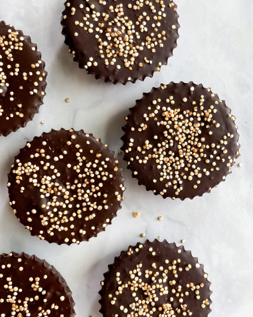 vegan crispy quinoa peanut butter cups on a white counter top 