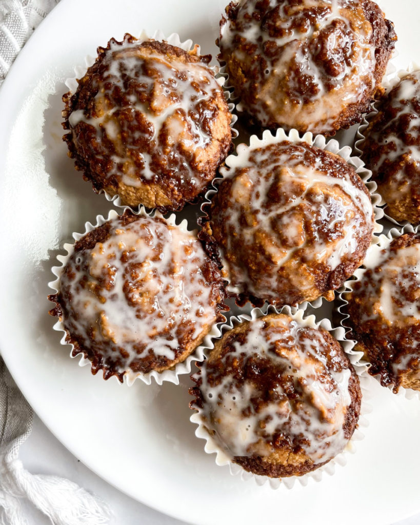 vegan gluten-free cinnamon roll muffins on a white plate 